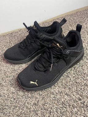Puma sneakers black and gold womens size 8.5 USA or 39Eur
